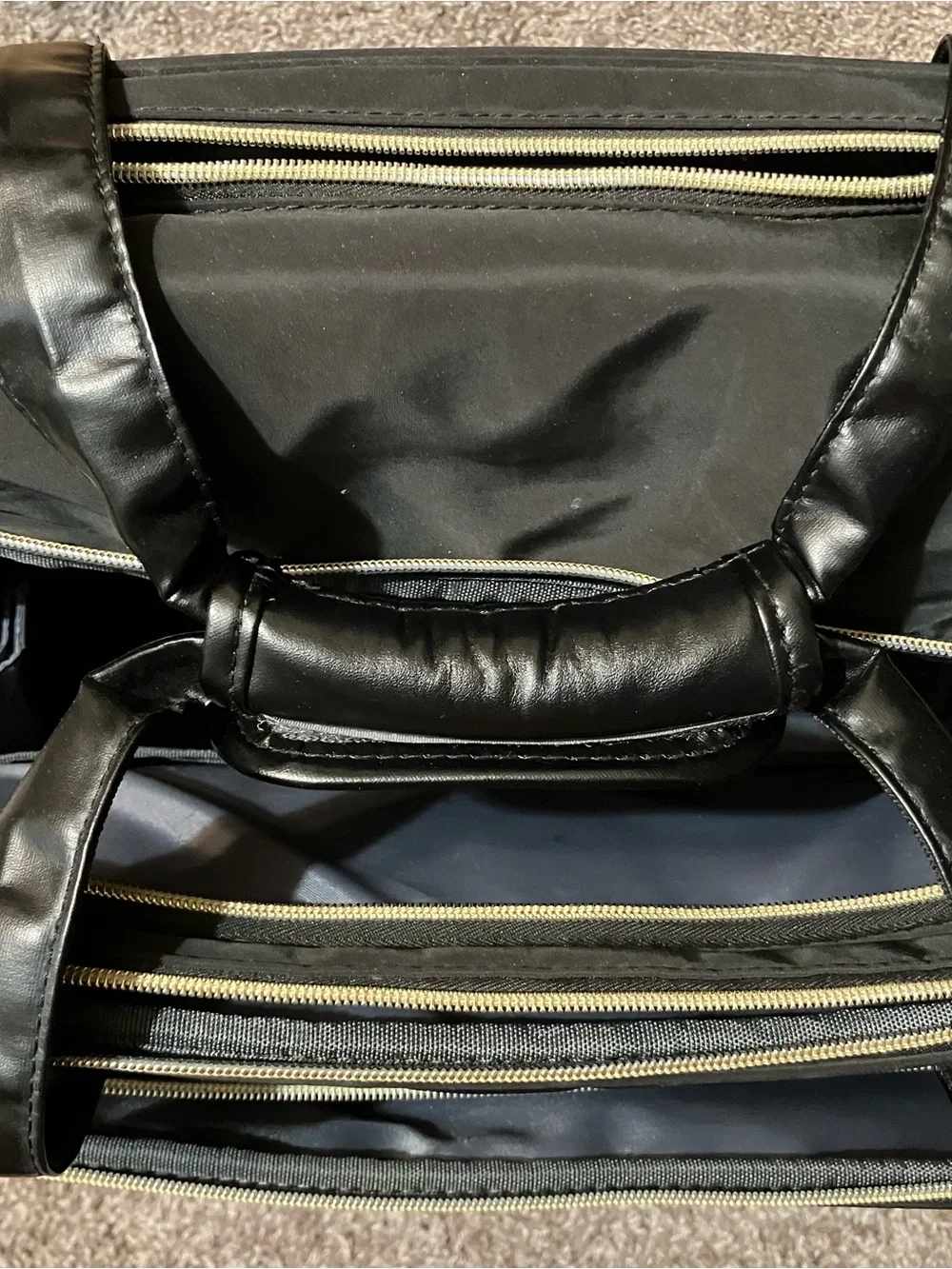 Quilted Black Rolling Travel Tote with Gold Accents